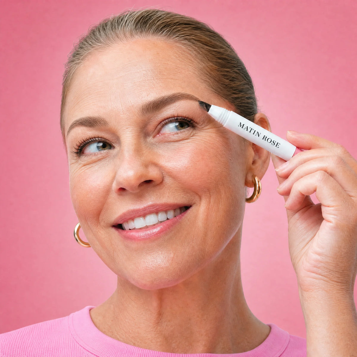 Woman applying MagicBrow brow brush